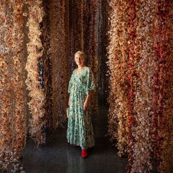 Marie Selby Botanical Gardens - Rebecca Louise Law standing amongst her installation of flowers titled Survival