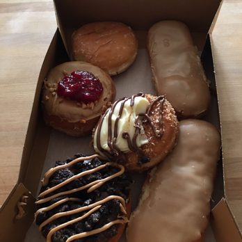 Delicious Donuts - Oreo with peanut butter drizzle, glazed with Bavarian cream and peanuts with Nutella drizzle, PB&J, maple bars, and glazed lemon filling. - Donuts Near Me - Portland, Oregon Delicious Donuts - Oreo with peanut butter drizzle, glazed with Bavarian cream and peanuts with Nutella drizzle, PB&J, maple bars, and glazed lemon filling. - Donuts Near Me - Portland, Oregon