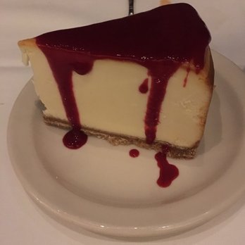 Harry & Izzy's - Large slice of cheesecake with raspberry sauce. Very good! - Steakhouses Near Me - Indianapolis, Indiana