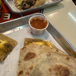 Vegetarian breakfast burrito and steak tostada