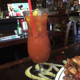 Nice dark bar with tons of TV's playing sports. Nice dark bar with tons of TV's playing sports.