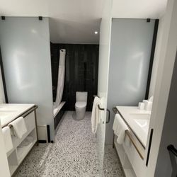 PGA National Resort - The bathroom of our room that had two sinks, each on opposite sides with a separate frosted glass partition and door.