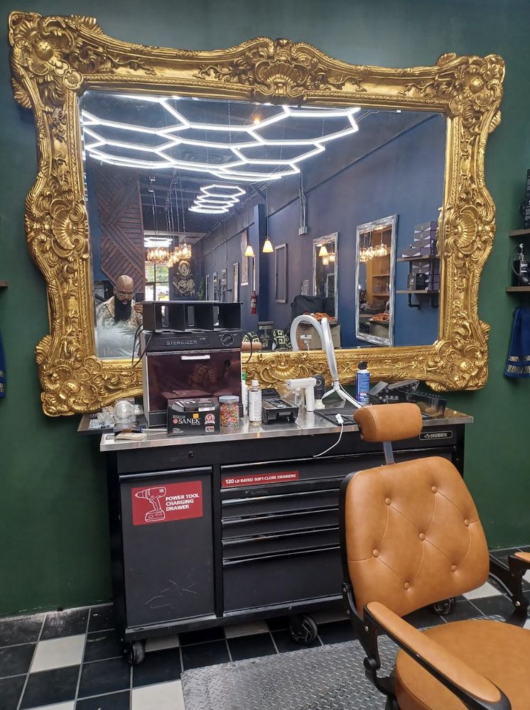 Vernon's Vintage Barbershop And Boutique Logo