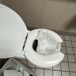 Inland Valley Hospital - Urine and blood left on toilet from previous patient room not clean