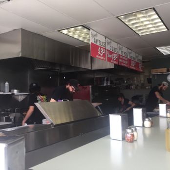 The Friendly - Sitting at the counter watching the cooks :) smells so so good! Watching them throw pizza dough! - Pizza Near Me - San Diego, California The Friendly - Sitting at the counter watching the cooks :) smells so so good! Watching them throw pizza dough! - Pizza Near Me - San Diego, California