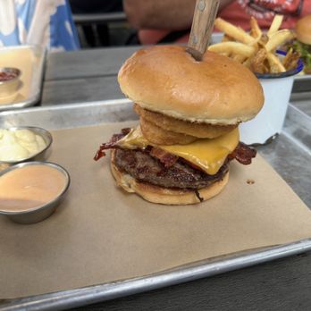 BrewDog - Cleveland - "Bacon Deluxe" Burger with bacon, cheddar cheese, onion rings, and BaconJam. Side of Siracha Mayo and regular mayo! - Brewpubs Near Me - Cleveland, Ohio