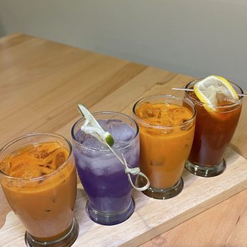 Manon - Flight of drinks -- Phuket Thai tea / Bangkok Breeze (butterfly pea tea) / Traditional Thai tea / Lemon iced tea) - Thai Near Me - Fullerton, California Manon - Flight of drinks -- Phuket Thai tea / Bangkok Breeze (butterfly pea tea) / Traditional Thai tea / Lemon iced tea) - Thai Near Me - Fullerton, California