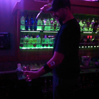 Last Call - a bartender pouring a drink at a bar - Sports Bars Near Me - Pflugerville, Texas