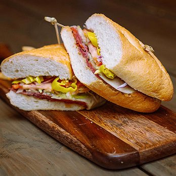 Lucky's - a sandwich cut in half on a cutting board - Lounges Near Me - Las Vegas, Nevada Lucky's - a sandwich cut in half on a cutting board - Lounges Near Me - Las Vegas, Nevada
