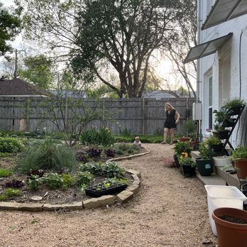 RCD Outdoors - a woman taking a picture of a garden - Landscape Architects or Designers Near Me - Forney, Texas RCD Outdoors - a woman taking a picture of a garden - Landscape Architects or Designers Near Me - Forney, Texas