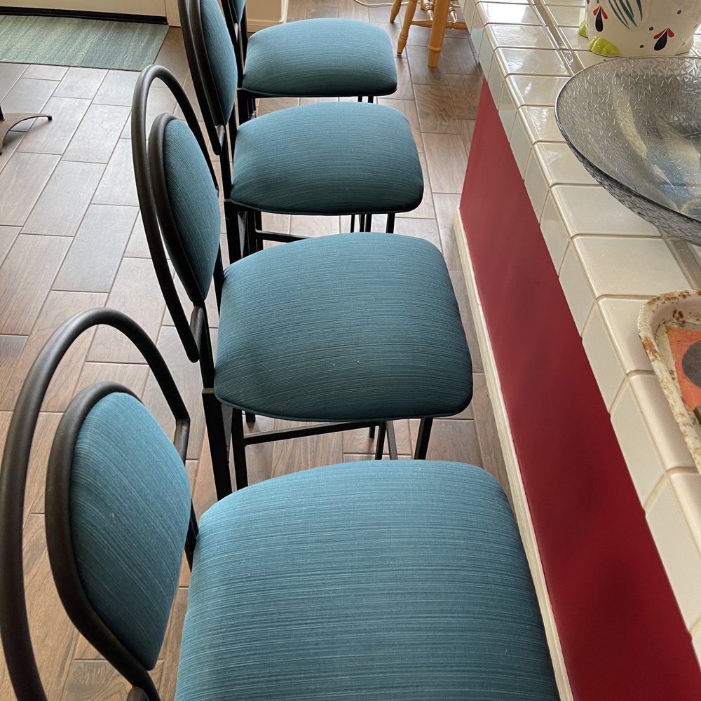 The reupholstered bar stools.