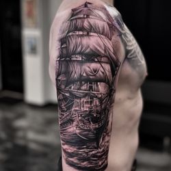 Sacred Raven Tattoo - This is a realistic black and grey ship, done in 2 full day sessions with Jamah.