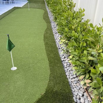 Garden Design Pros - Perfect conversation of Artificial Turf, Clusia and Mexican Beach Pebbles - Landscaping Near Me - West Palm Beach, Florida Garden Design Pros - Perfect conversation of Artificial Turf, Clusia and Mexican Beach Pebbles - Landscaping Near Me - West Palm Beach, Florida