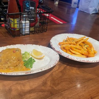 Tipsy Trumpet - Louisiana Crab Cake (appetizer) and a side of fries. Tasty. - Bars Near Me - New Orleans, Louisiana Tipsy Trumpet - Louisiana Crab Cake (appetizer) and a side of fries. Tasty. - Bars Near Me - New Orleans, Louisiana