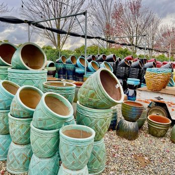 Wyntour Gardens - While many of the ceramic pots are along the fence, be sure to walk the gardens to find hidden gems. - Nurseries & Gardening Near Me - Redding, California