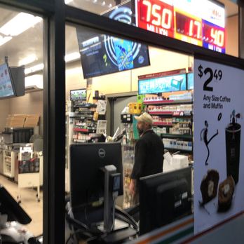7-Eleven - a man at a cash register - Convenience Stores Near Me - Arcadia, California