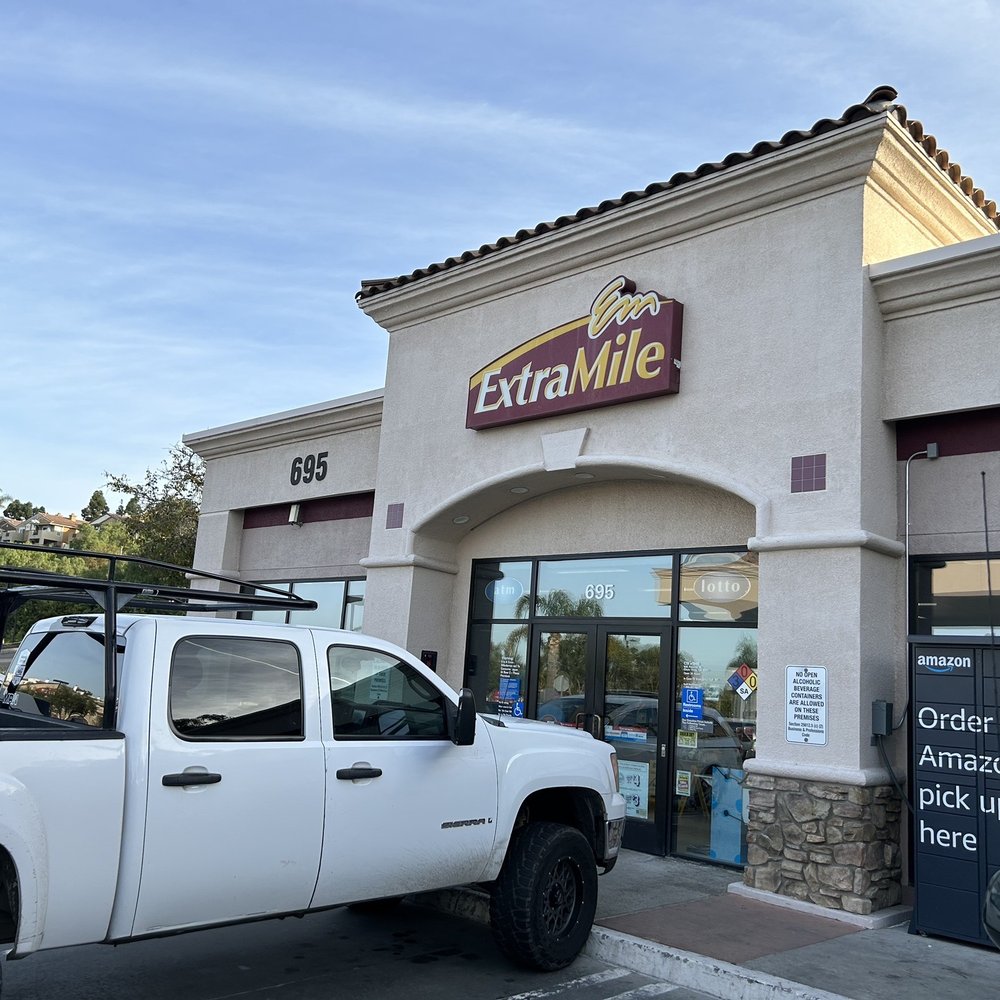 a truck parked in front of a restaurant