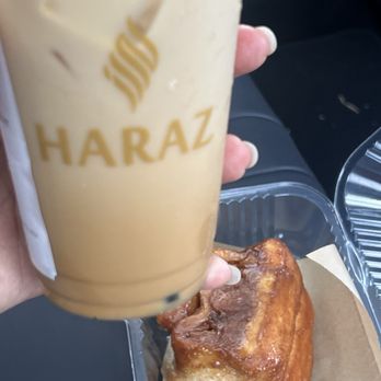 Haraz Coffee House - White Mocha Latte(16oz) and Knaus Berry Cinnamon RollCinnamon - Coffee & Tea Near Me - Pembroke Pines, Florida