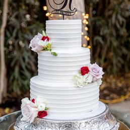 We added just a couple of flowers . The design on the frosting qas JUST as we requested.
