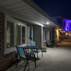 Miami Motel - Love the brick and the splashes of color with the doors and chairs.