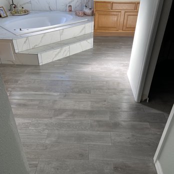 David's Tile - a bathroom with a large tub - General Contractors Near Me - Winter Springs, Florida