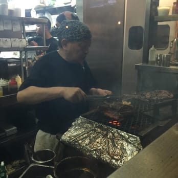 Tiger Den - Chef making yakitori (Japanese skewered food cooked over a robata grill) - Ramen Near Me - Houston, Texas Tiger Den - Chef making yakitori (Japanese skewered food cooked over a robata grill) - Ramen Near Me - Houston, Texas