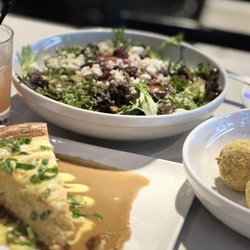 Phil's Oyster Bar & Seafood - Boudin balls, savory crawfish cheesecake, salad and tasty adult beverage.