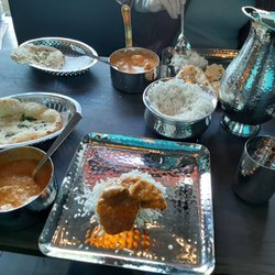 Bombay Street - Bangali lamb curry, butter chicken, garlic naan, and cheese naan