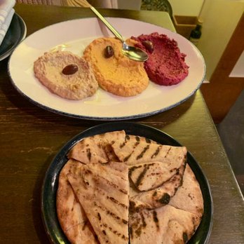 Extra Virgin - Left is the eggplant, the middle is carrot hummus, and the right is beet hummus. Don't be afraid to add garlic and tahini to the hummus. - Tapas/Small Plates Near Me - Kansas City, Missouri
