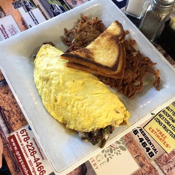 Sam's on Main - Prime rib omelette...and did I mention how amazing the toast is...so good! - Mediterranean Near Me - Grayson, Georgia