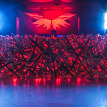 Nest - a stage with red and blue lights - Dance Clubs Near Me - Toronto, Ontario