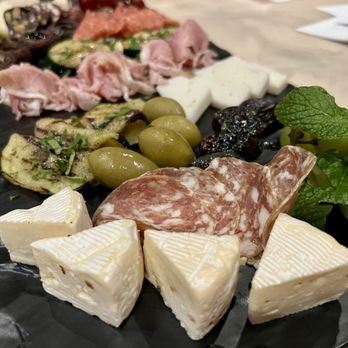 Anila’s Cucina Rustica - Charcuterie platter, Romano, goat cheese and Bree cheeses with nice salty meats and olives.  Delicious!! - Italian Near Me - Pala, California