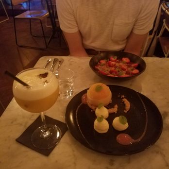 Le Caulaincourt - Poached peach dessert and strawberry panna cotta dessert with passionfruit cocktail. So tasty! - Bars Near Me - Paris, 75