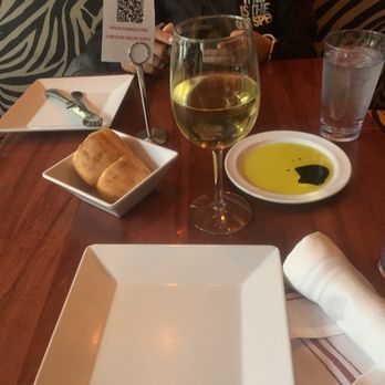 Carmelina's - Complimentary Bread and a glass of Chardonnay - Italian Near Me - Boston, Massachusetts Carmelina's - Complimentary Bread and a glass of Chardonnay - Italian Near Me - Boston, Massachusetts