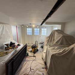 Gold Mountain Contracting - Cutting a trench to rewire an old house that had knob and tube