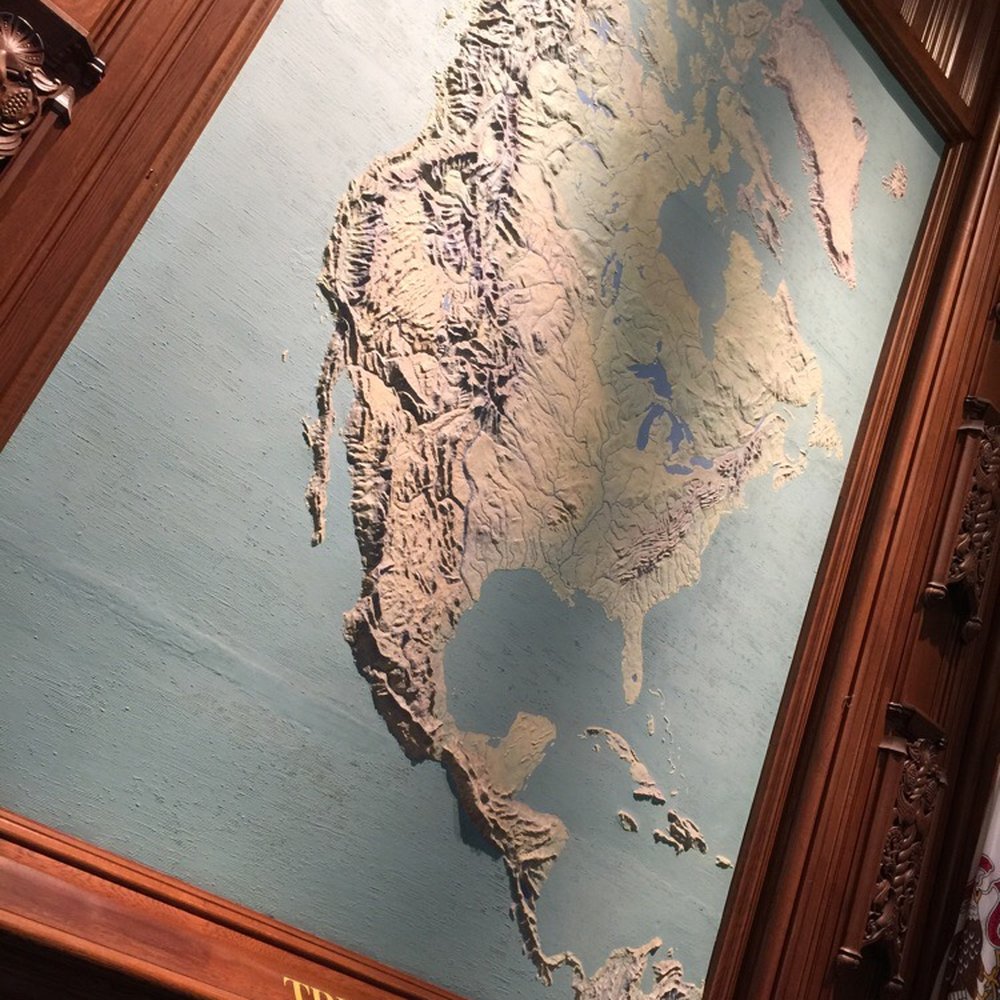 The map at the front desk is made up of MILLIONS of $$$ of shredded money. The map at the front desk is made up of MILLIONS of $$$ of shredded money.