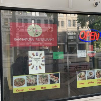 Nai restaurant - a large window with a menu in it - Sushi Bars Near Me - Buffalo, New York