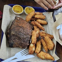 Caino's BBQ at the Red Barn - Ribs hush puppies. Mac with a sausage link