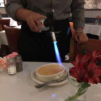 Cafe Amore - Caramelizing the sugar on the creme brûlée at Cafe Amore in Richardson, TX! - Cafes Near Me - Richardson, Texas