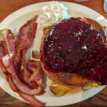 The Cookie Jar - Stuffed Nolan's - cream cheese stuffed cinnamon roll, grilled and topped with berry compote and whipped cream, with bacon - Breakfast & Brunch Near Me - Fairbanks, Alaska