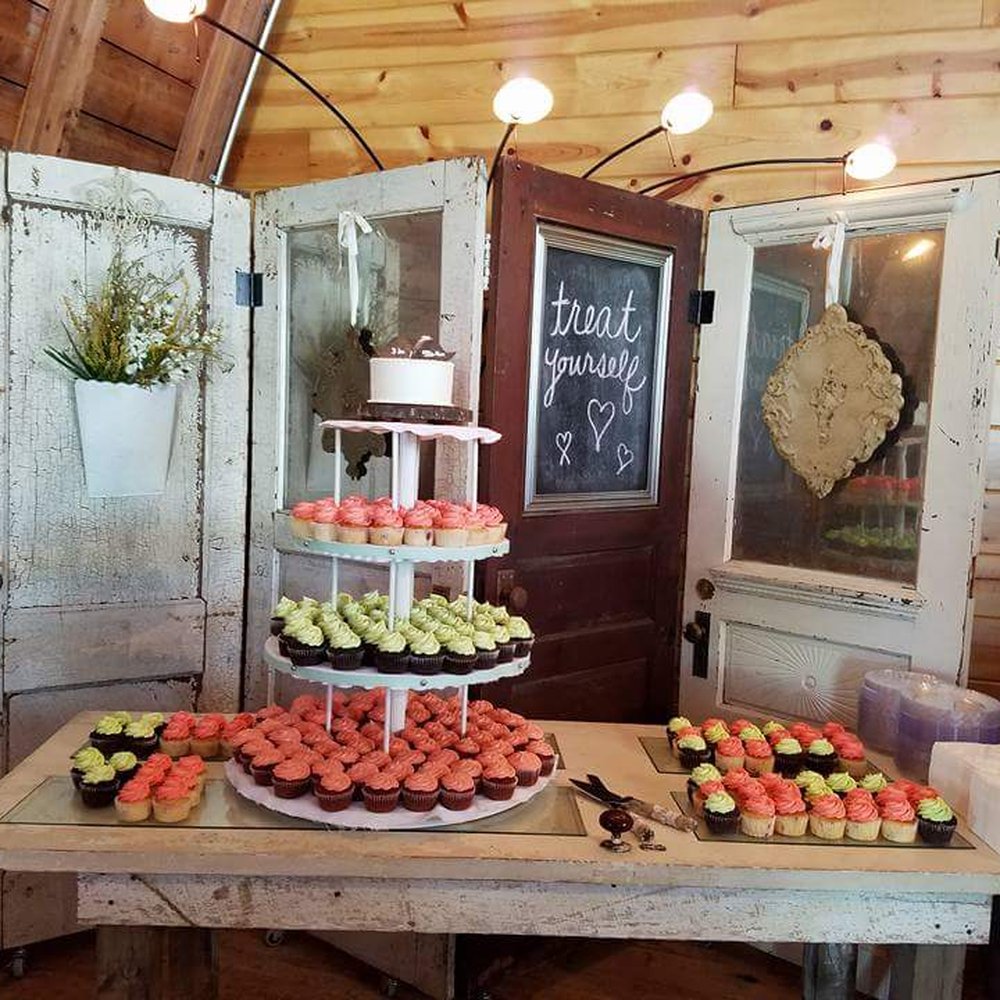 A photo of our cupcake set up! Awesome right?! Sally's delivered and set up the cupcakes too! A photo of our cupcake set up! Awesome right?! Sally's delivered and set up the cupcakes too!