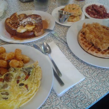 Over Easy - Arcadia - Chicken Fried Chicken and Waffle, corned beef hash, half an order of brioche banana French toast & a sausage and bacon omelette. - Breakfast & Brunch Near Me - Phoenix, Arizona Over Easy - Arcadia - Chicken Fried Chicken and Waffle, corned beef hash, half an order of brioche banana French toast & a sausage and bacon omelette. - Breakfast & Brunch Near Me - Phoenix, Arizona