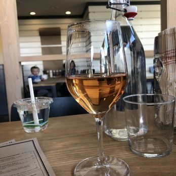 Wursthall - Glass of Rośe & water while watching our kids at the children's table - German Near Me - San Mateo, California