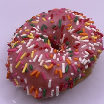 Donut Planet Cafe - Brandon - a pink donut with sprinkles - Coffee & Tea Near Me - Brandon, Mississippi