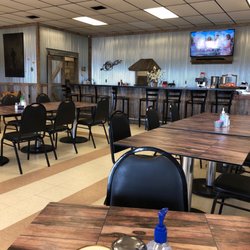 The Market - Tables; front counter; interior of restaurant