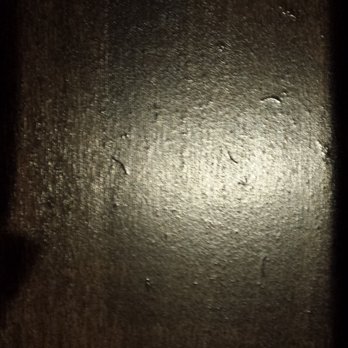 Caissie Hardwood Flooring - bubbles & debris - Flooring Near Me