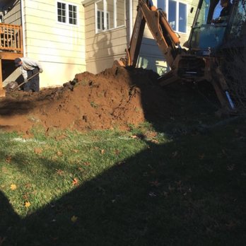 A O'Reilly Landscaping - a bulldozer digging a lawn - Landscaping Near Me A O'Reilly Landscaping - a bulldozer digging a lawn - Landscaping Near Me