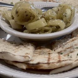 Covered Bridge Inn - Hot peppers in oil served with fresh baked warm seasoned pita bread