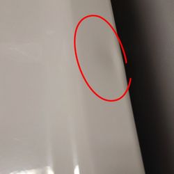 Lowe's Home Improvement - A fiasco of a time getting our dryer delivered. Came with two dents. Visible dent here.