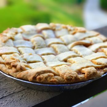 Shut Your Pie Hole Bakery - a pie on a wooden table - Desserts Near Me Shut Your Pie Hole Bakery - a pie on a wooden table - Desserts Near Me